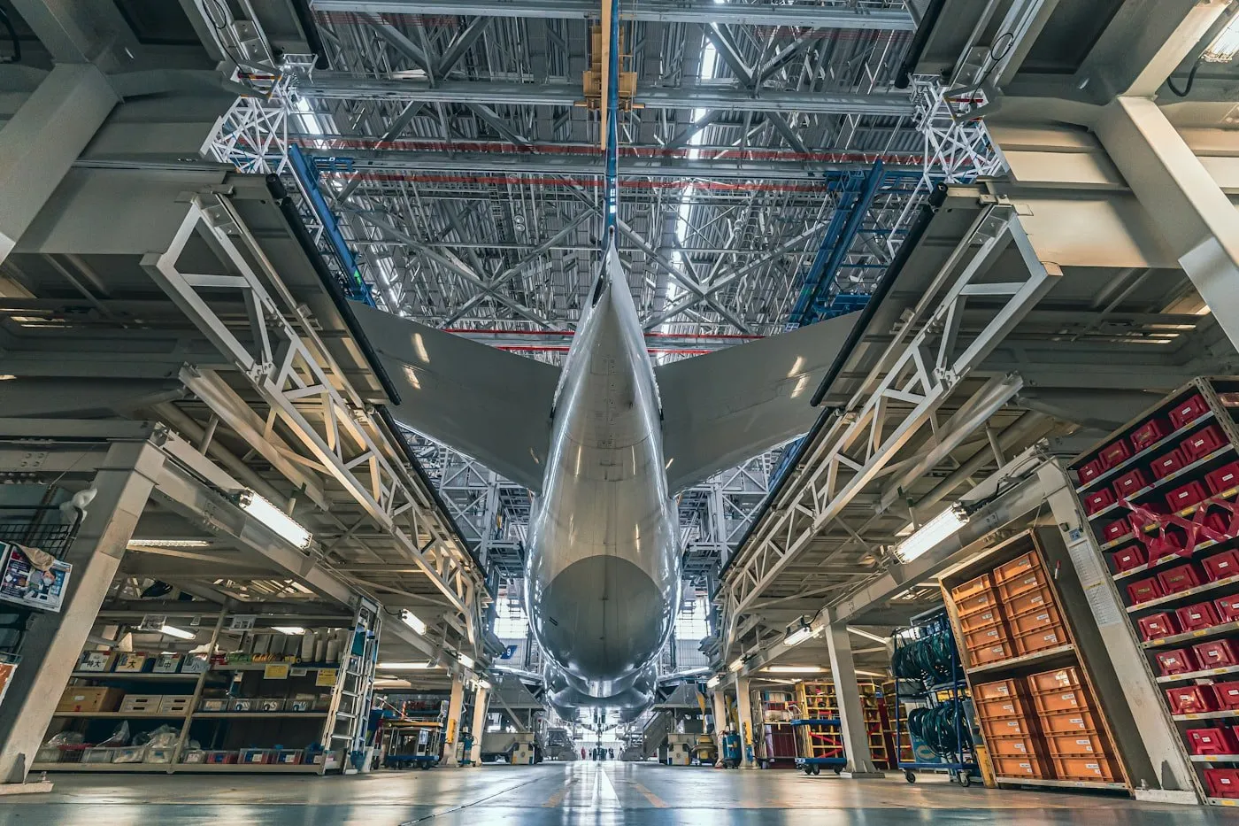 An aircraft fuselage in an assembly hall, surrounded by access staging.