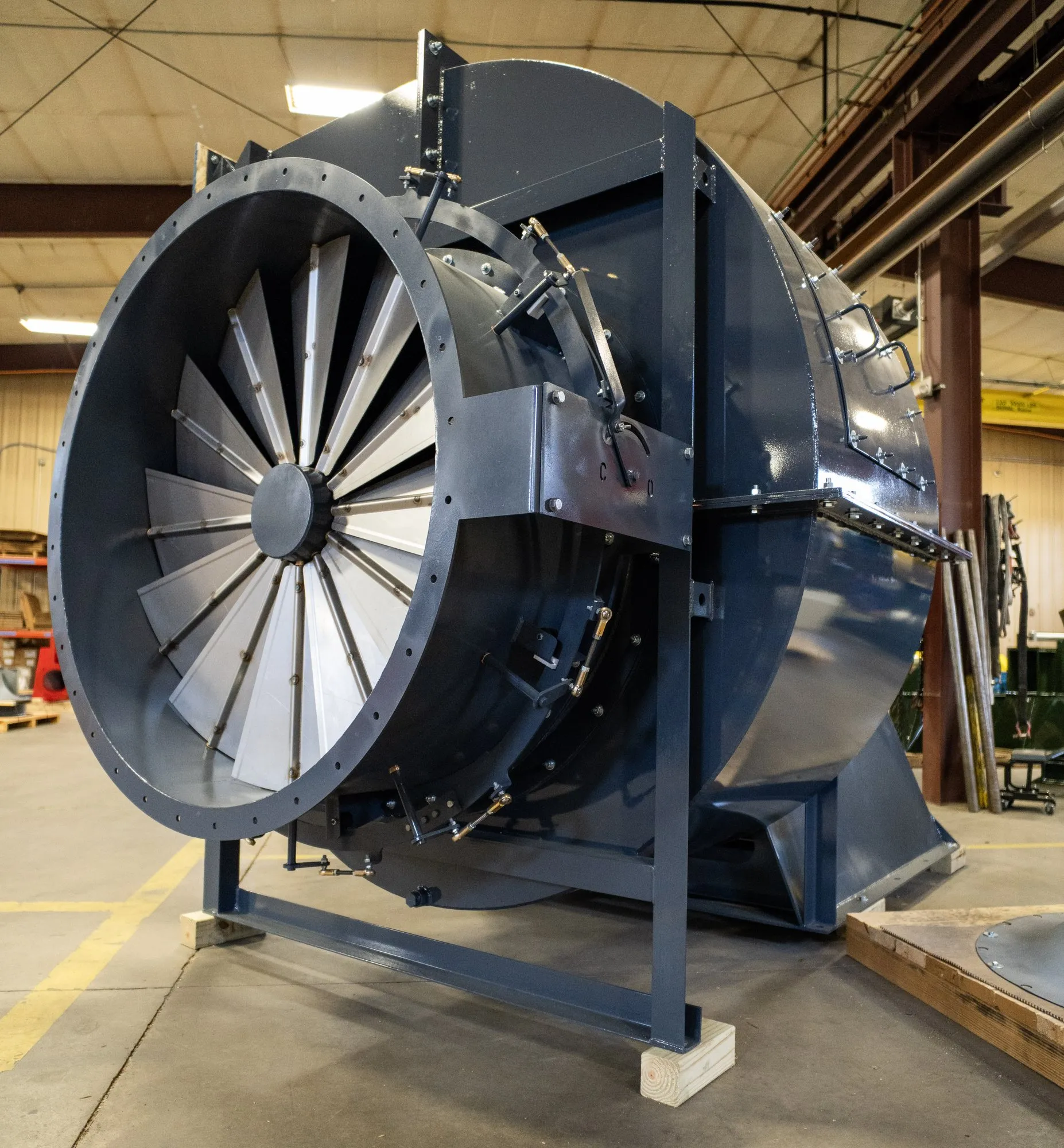 A large AirPro centrifugal fan assembled on a shop floor, its bladed inlet cone facing the camera.